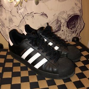 Black and white adidas superstar sneakers